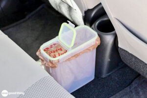 Makeshift car trash can.