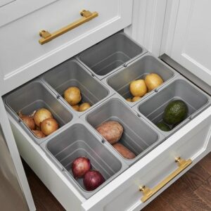 Fruits and vegetables in containers in kitchen drawer.