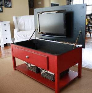 Coffee table with TV in it.