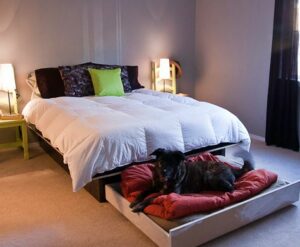 Bedroom with drawer under bed.