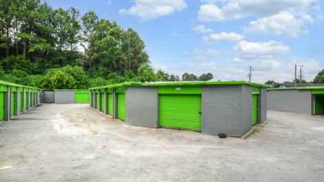 Outside Storage with Green Garage Doors.