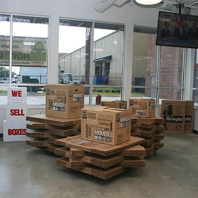 Moving boxes for sale in a Space Shop office.