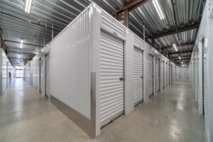 Inside storage facility looking down hallways with indoor units.