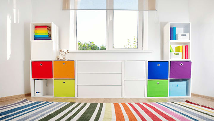 Kids bedroom with colorful built in storage.
