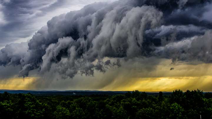 Aerial view of a storm cloud dropping rain.