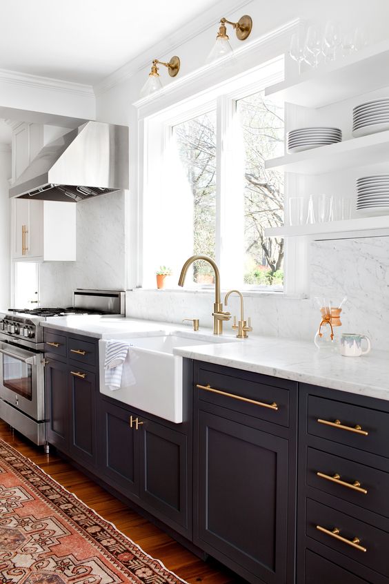 Fully decorated white and black kitchen.