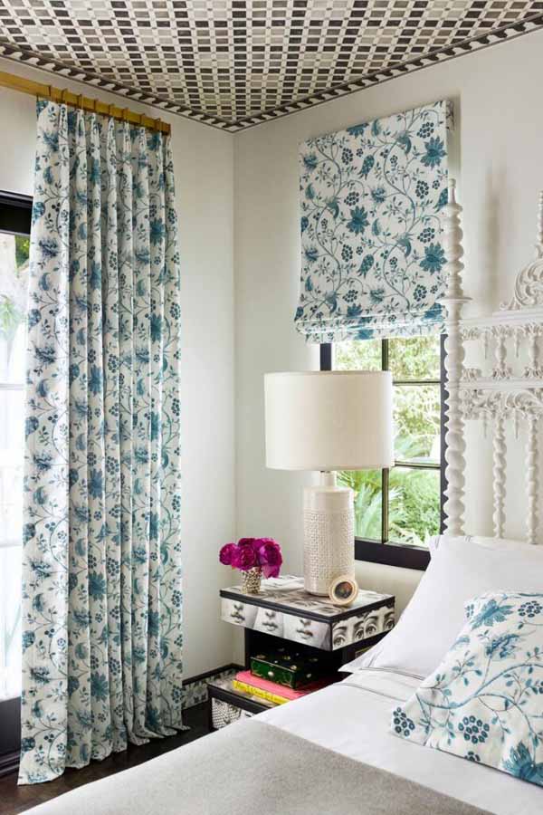 Fully decorated bedroom with white and blue accents.