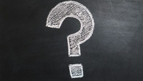 Question mark written on chalkboard.