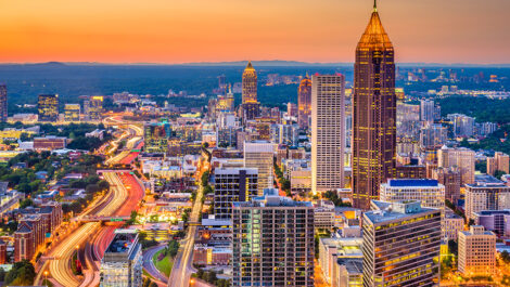 Atlanta skyline during sunset showing Pencil building and skyscrapers and busy highway